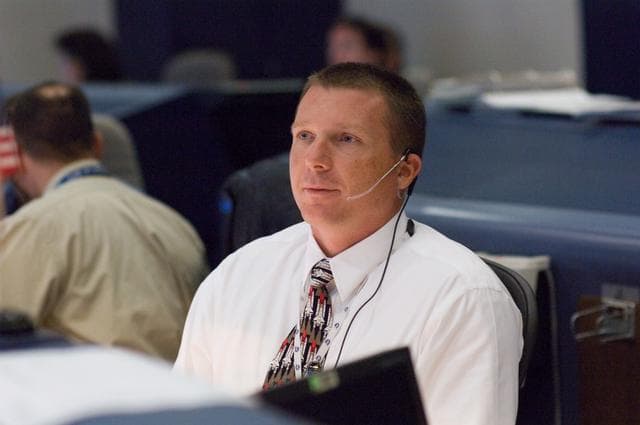 NASA image: STS-120 Flight Controllers on console during mission (Launch) - (Bldg. 30s, WFCR)