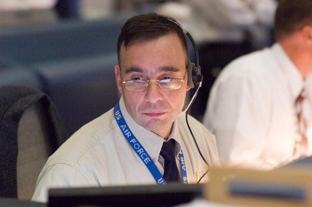NASA image: STS-120 Flight Controllers on console during mission (Launch) - (Bldg. 30s, WFCR)