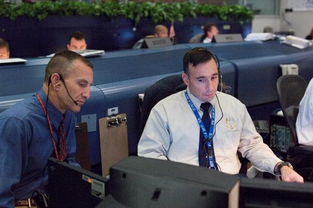 NASA image: STS-120 Flight Controllers on console during mission (Launch) - (Bldg. 30s, WFCR)