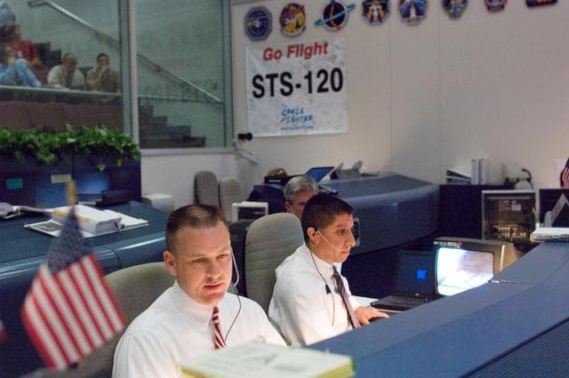 NASA image: STS-120 Flight Controllers on console during mission (Launch) - (Bldg. 30s, WFCR)