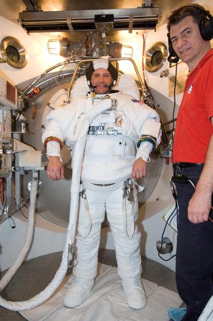 NASA image: STS-120 Preflight Training in the SSATA Airlock with Doug Wheelock