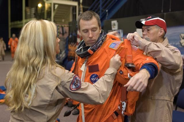 NASA image: STS-125 Crew during Post Insertion/Deorbit Prep training in CCT II mockup.