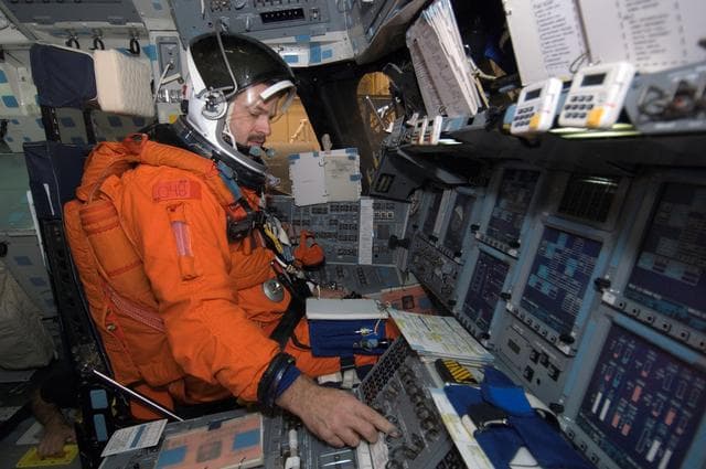 NASA image: STS-125 Crew during Post Insertion/Deorbit Prep training in CCT II mockup.