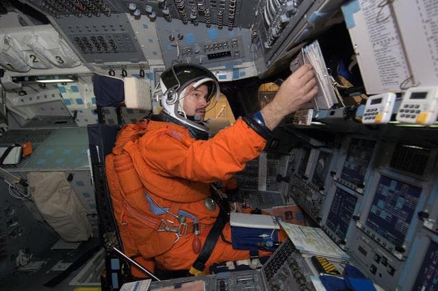 NASA image: STS-125 Crew during Post Insertion/Deorbit Prep training in CCT II mockup.
