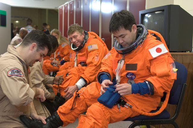 NASA image: STS-124 during crew/training team photos, suit up and ASC/CAP/DES training