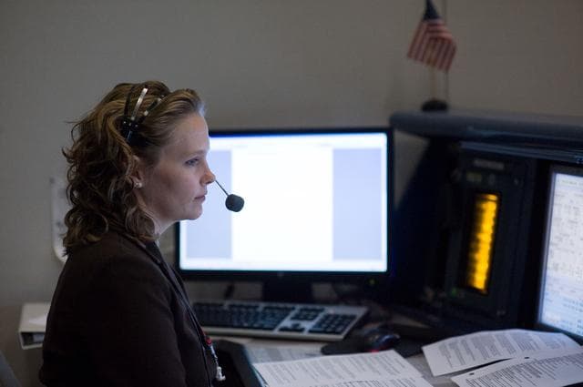 NASA image: STS-119 Flight Controllers on Console - Launch - Bldg. 30south. Flight Director: Richard Jones 