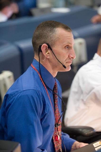NASA image: STS-119 Flight Controllers on Console - Launch - Bldg. 30south. Flight Director: Richard Jones 