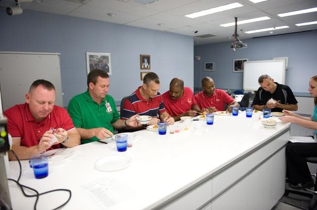 NASA image: STS-129 food tasting  session.