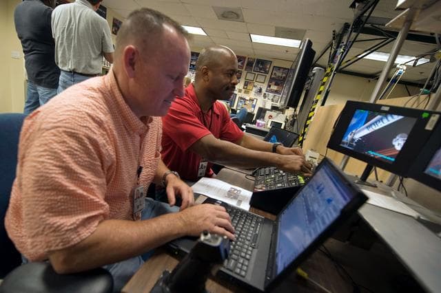 NASA image: STS-129 crew training in the JSC VR lab during SSRMS refresher training. 