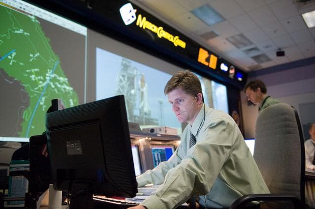 NASA image: STS-125 Flight Controllers on Console - (Orbit Shift)