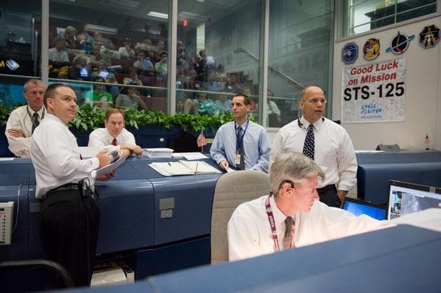 NASA image: STS-125 Flight Controllers on Console - (Orbit Shift)