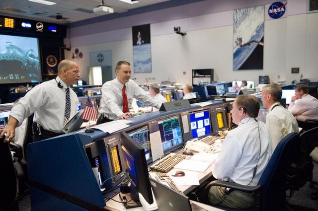 NASA image: STS-125 Flight Controllers on Console - (Orbit Shift)