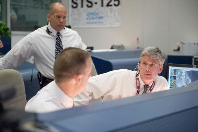 NASA image: STS-125 Flight Controllers on Console - (Orbit Shift)