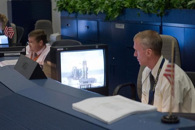 NASA image: STS-125 Flight Controllers on Console - (Orbit Shift)