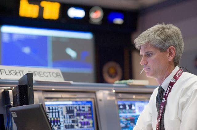 NASA image: STS-125 Flight Controllers on Console - (Orbit Shift)