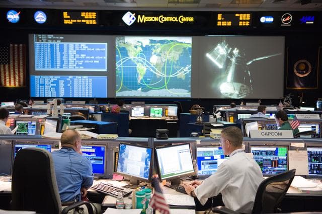 NASA image: STS-125 Flight Controllers on Console During HST Grapple - Orbit 1. Flight Director: Tony Ceccacci 