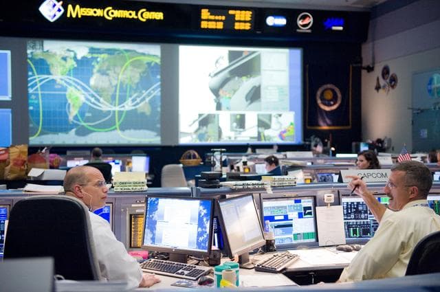 NASA image: STS-125 Flight Controllers on Console - (Orbit Shift 1). Flight Director: Anthony Ceccacci 