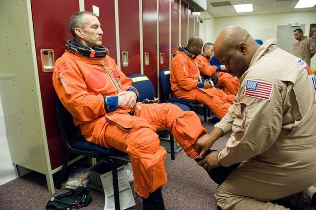 NASA image: STS-129 Preflight Training. Suited payload egress training.