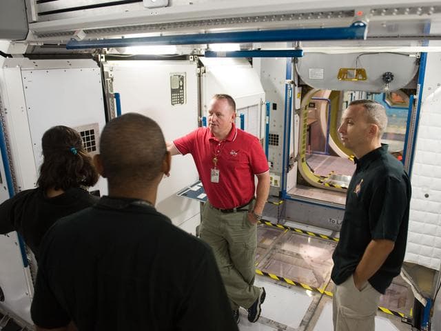 NASA image: STS-129 crew during trans hands-on review in the space station mockups. 
