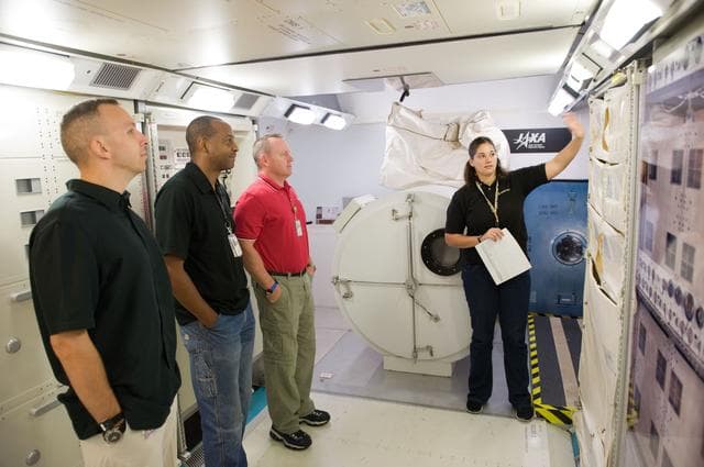 NASA image: STS-129 crew during trans hands-on review in the space station mockups. 