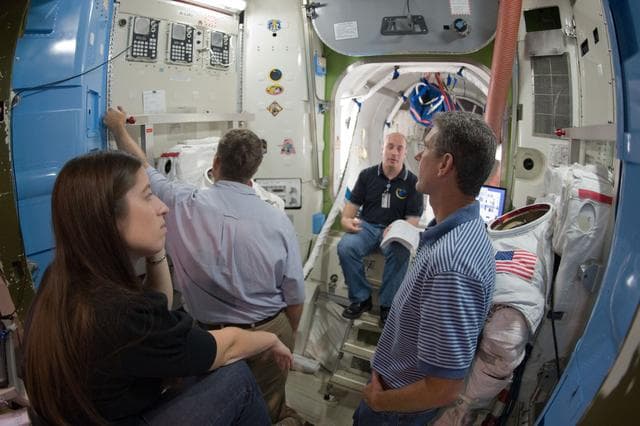 NASA image: STS-132 crew during SSMTF ISS EVA P/P training with instructor Megan Murphey 