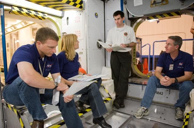 NASA image: STS-130 crew and Expedition 22 crew member T.J. Creamer during module outfitting training. 