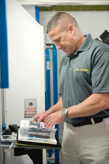 NASA image: STS-130 crew and Expedition 22 crew member T.J. Creamer during module outfitting training. 