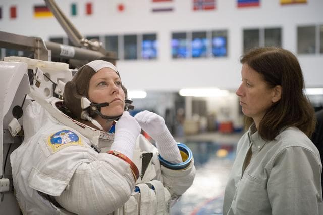NASA image: Expedition 24 crew members Tracy Caldwell and Doug Wheelock during ISS EVA 1 91027 training 
