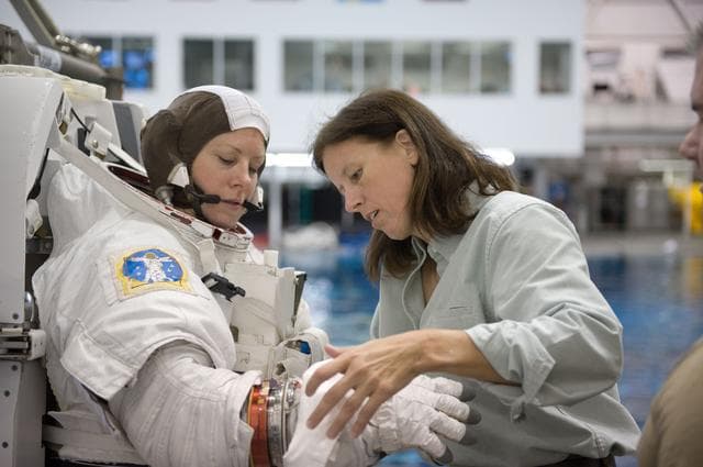 NASA image: Expedition 24 crew members Tracy Caldwell and Doug Wheelock during ISS EVA 1 91027 training 