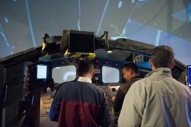NASA image: STS-132 crew during their PDRS N-TSK MRM training in the building 16 cupola trainer. 