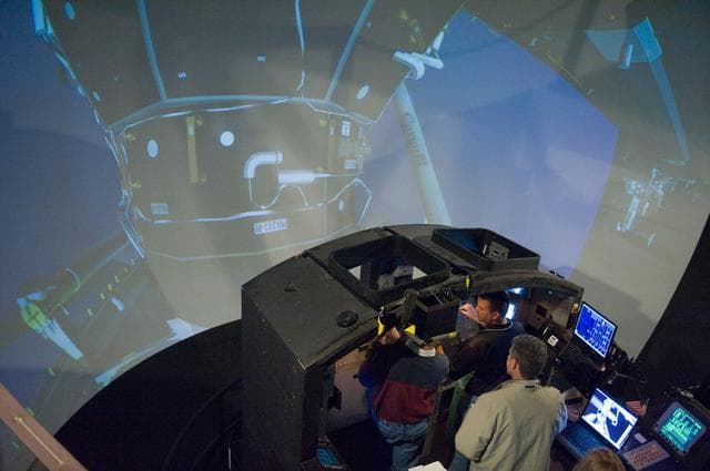NASA image: STS-132 crew during their PDRS N-TSK MRM training in the building 16 cupola trainer. 