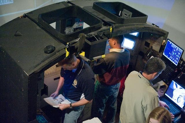 NASA image: STS-132 crew during their PDRS N-TSK MRM training in the building 16 cupola trainer. 