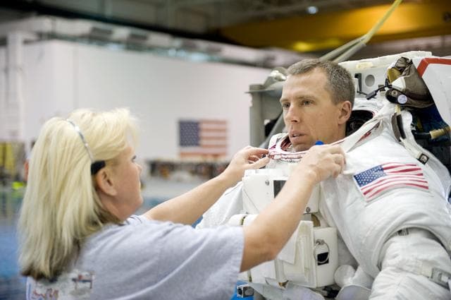 NASA image: STS-134 crew members Greg Chamitoff and Drew Feustel during their STS-134 ULF6 EVA1 training at the NBL. 