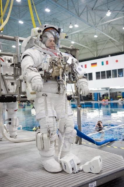 NASA image: STS-134 crew members Greg Chamitoff and Drew Feustel during their STS-134 ULF6 EVA1 training at the NBL. 