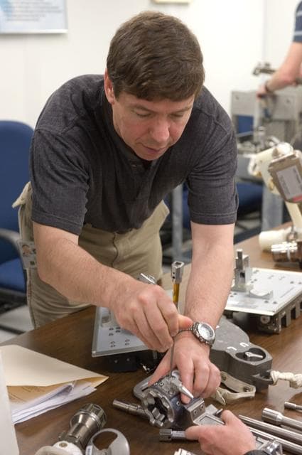 NASA image: STS-133 crew during ISS Small Tools training with instructor Jake Delap. 