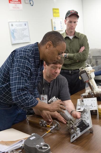 NASA image: STS-133 crew during ISS Small Tools training with instructor Jake Delap. 