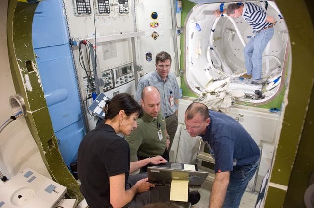 NASA image: STS-132 crew during ISS TOOL Configuration with instructor Lisa Shore. 