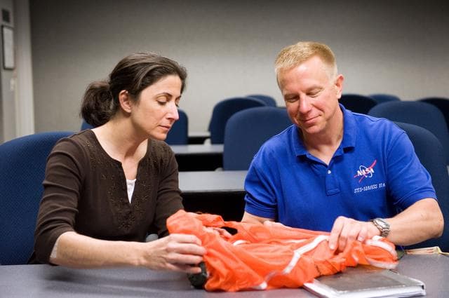 NASA image: STS-133 crew during water survival briefing in the classroom