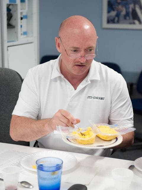 NASA image: STS-134 crew during food tasting session in JSC Food Lab.