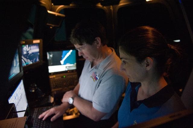 NASA image: STS-133 crew members Mike Barratt and Nicole Stott in cupola
