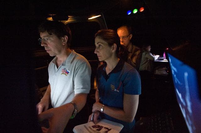 NASA image: STS-133 crew members Mike Barratt and Nicole Stott in cupola