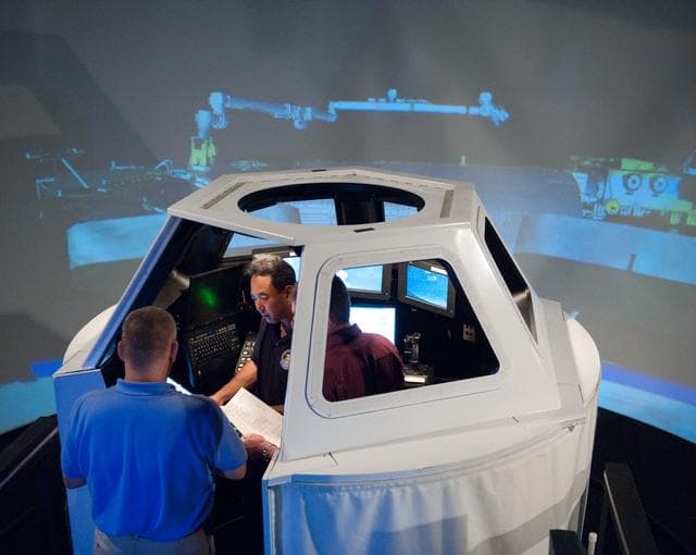 NASA image: Satoshi Furukawa during FF RNDZ ADV1 training in the ISS cupola trainer in the SES dome.