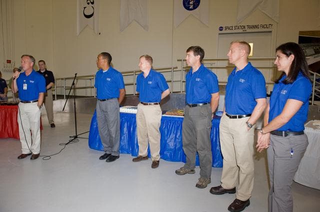 NASA image: STS-133 cake cutting ceremony marking the end of their training.  