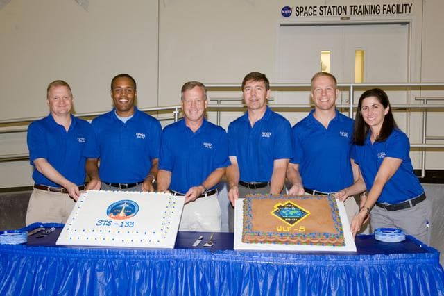 NASA image: STS-133 cake cutting ceremony marking the end of their training.  