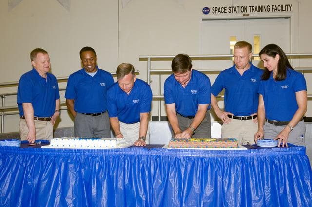 NASA image: STS-133 cake cutting ceremony marking the end of their training.  