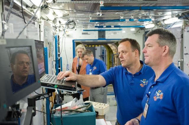 NASA image: Expedition 27 crew members Ron Garan, Andre Borisenko and Aleksandr Samokutyaev   