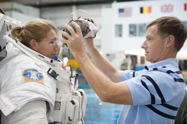 NASA image: STS-335 (135) crew members Rex Walheim and Sandy Magnus  