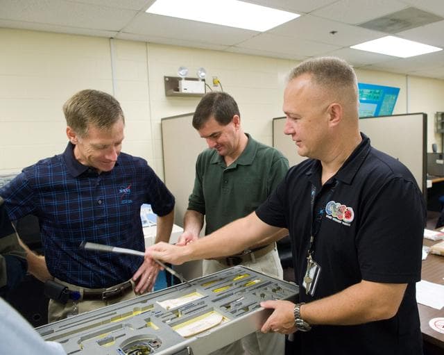 NASA image: STS-335 crew training, Tool/Repair Kits with instructor Jeff Stone   