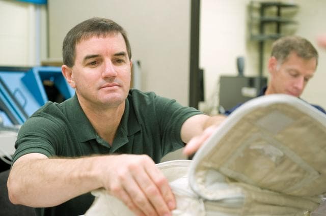 NASA image: STS-335 crew training, Tool/Repair Kits with instructor Jeff Stone   