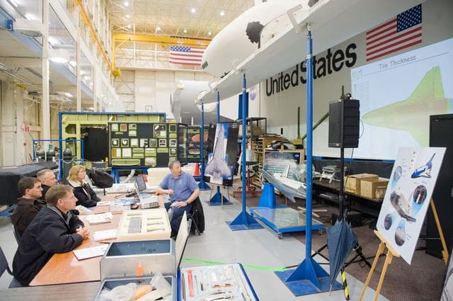 NASA image: STS-335 crew training, EVA TPS Overview with instructor John Ray